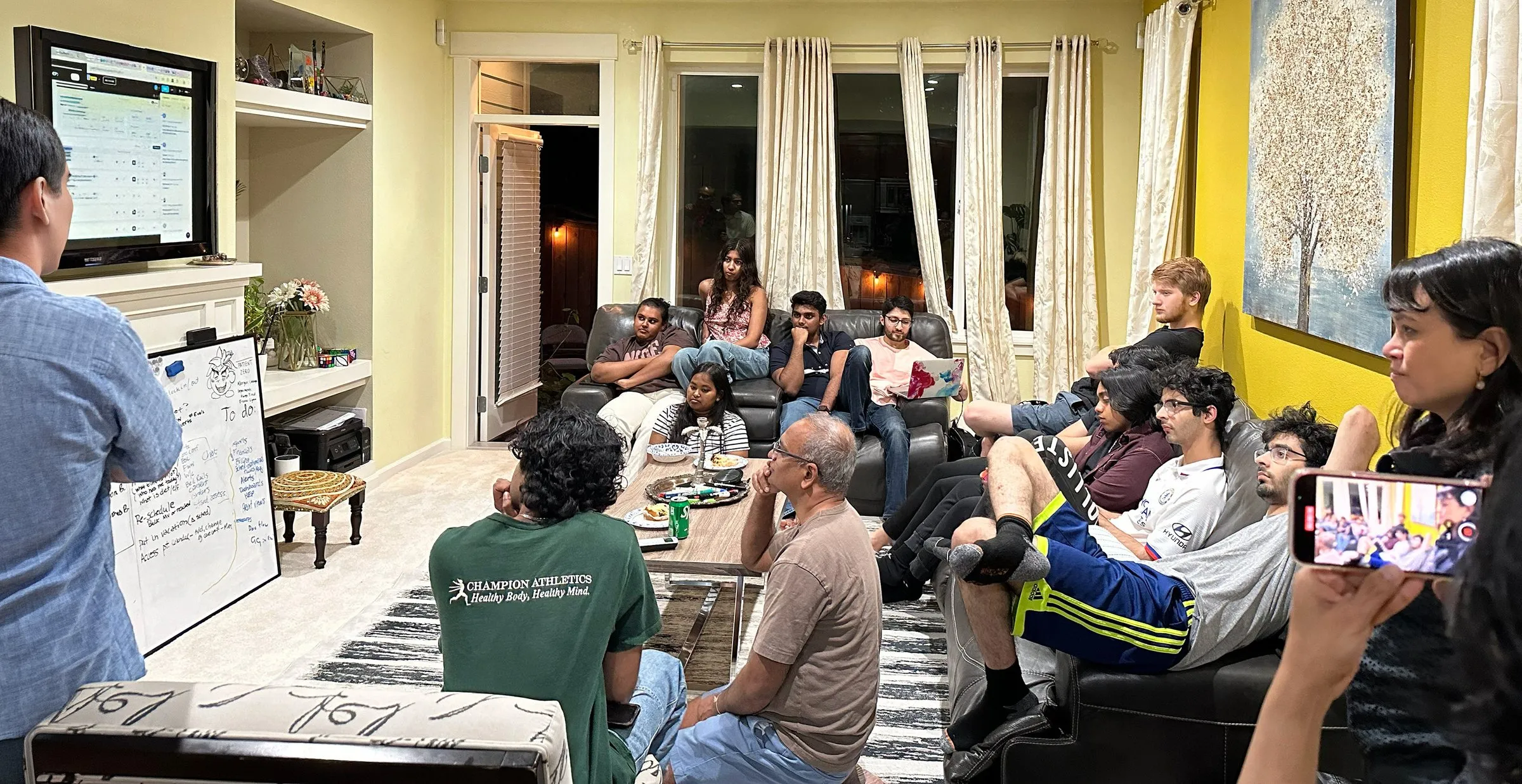 A CareDocs.ai working session — the team gathered around a whiteboard